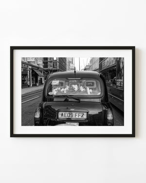 London taxi with white roses photo