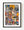Colourful London street-art wall with layered stickers, torn posters and a large painted face