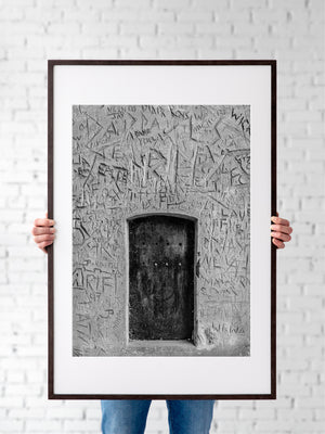 Historic London doorway surrounded by scratched plaster textures
