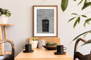 Medieval door with carved plaster surface in black and white