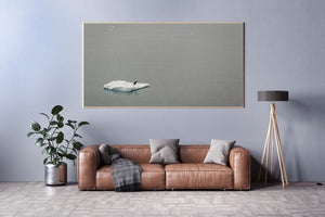 Lone penguin on floating ice in a muted colour Antarctic photograph