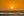 ロサンゼルス近郊の穏やかな太平洋の波に沈む夕日