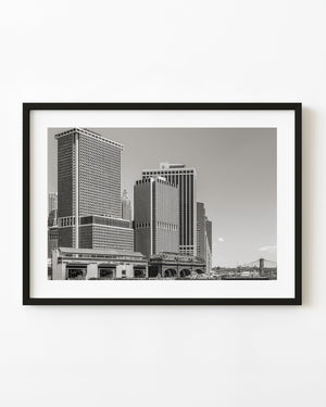 Lower Manhattan waterfront buildings and piers in black and white