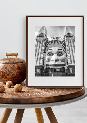 Luna Park entrance face and radiating decorative panels beneath a cloudy sky