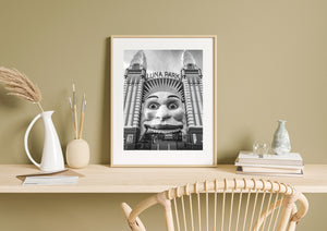 Twin Luna Park towers rise above the landmark smiling entrance in Sydney