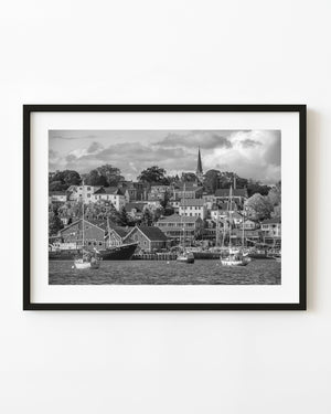 Black and white photograph of sailboats and hillside homes in Lunenburg Harbour