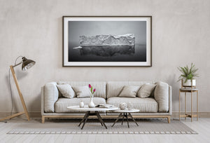 Iceberg with Cliffs Plunging into Calm Sea