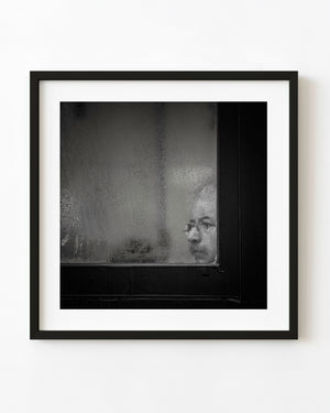 Man seen through a fogged window in Toronto black and white
