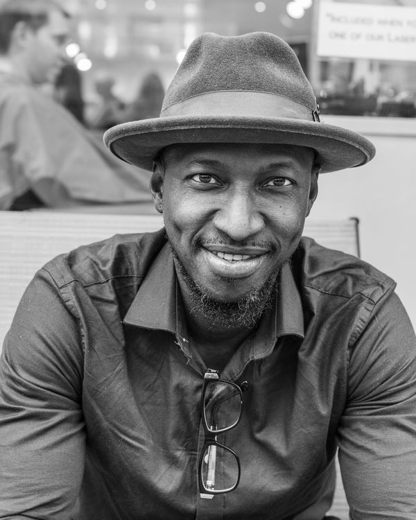 Black and white portrait man in fedora NYC