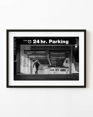 Black and white Manhattan parking garage with two men