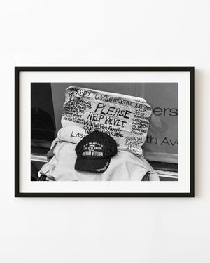 Vietnam veteran hat and handwritten sign New York street