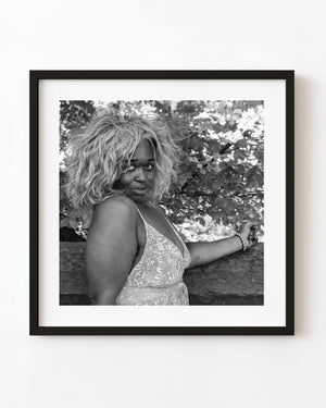 Black and white Manhattan street portrait of woman in voluminous wig