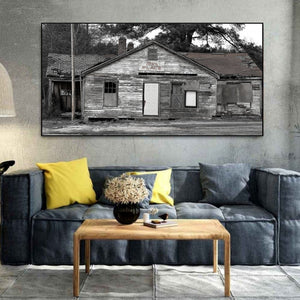 Black and white photo of abandoned roadside building