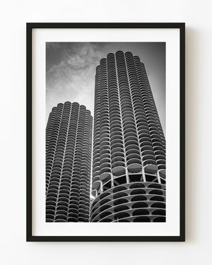 Black and white photograph of Marina City Towers in Chicago viewed from below