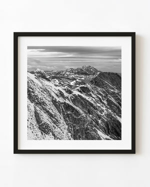 Black and white Martial Mountains landscape with snow-streaked rocky ridges