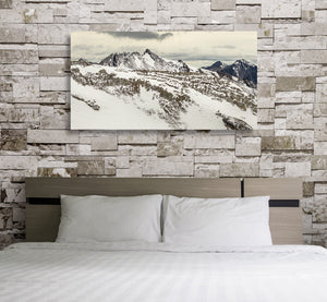 Martial Mountains panorama with exposed rock and broad snow-covered slopes