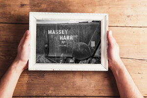 Faded Massey Harris logo on old Saskatchewan equipment