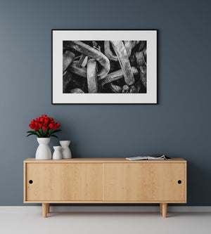 Monochromatic portrayal of towering chains, emphasizing their majestic scale and the textures that narrate their storied past.