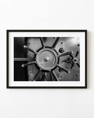 Black and white antique bank vault locking wheel detail