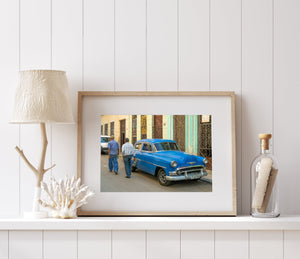 Men walking by classic car in Cuba print