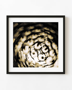 Abstract sepia photograph of Mexican wine bottles blurred into a swirl