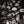 Monochrome pattern of wine bottle necks in cellar rack