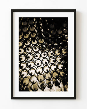Abstract photograph of glowing wine bottles in a Mexican cellar