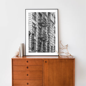 Midtown Manhattan architectural photograph with fire escapes and salon banners