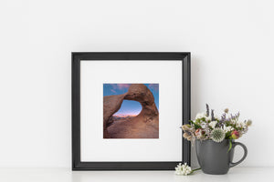 Colour landscape of weathered granite and pink clouds at Mobius Arch