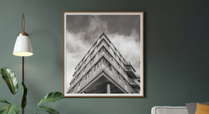 Oslo building facade photographed upward beneath textured clouds