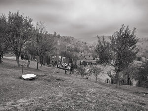 Hillside landscape with laundry hanging between trees Romania