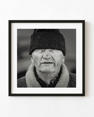 Elderly man in knit hat portrait Moldovita Romania monochrome
