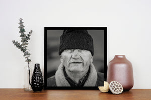 Weathered male face wearing winter cap rural Romania