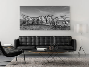 Wide panoramic scene of eagle riders in desert landscape