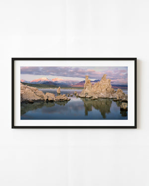 Mono Lake tufa towers and snowy mountains in soft sunrise light