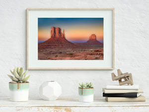 Sunlit Monument Valley Mittens beneath blue, peach and violet twilight colours