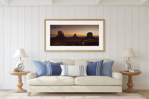 Silhouetted buttes in Monument Valley at dusk