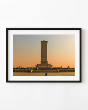 Monument to the People’s Heroes in Beijing beneath a warm sunset sky