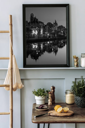 Reflections in Amsterdam canal just before sunrise