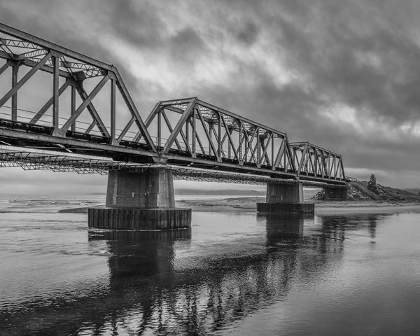 Black-and-white train bridge photography