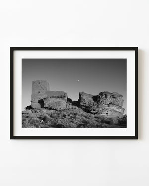 Moon above Wukoki Pueblo ruins in an Arizona black and white photograph