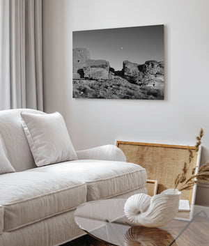 Wukoki Pueblo tower and sandstone outcrop in black and white
