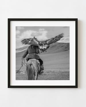 Kazakh eagle hunter riding horseback in western Mongolia