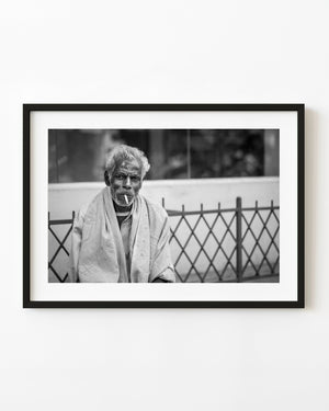 Elderly man smoking in Mysore India in black and white