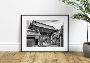 Japanese religious architecture with stone path and timber beams