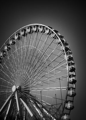 Upward view of Chicago Navy Pier Ferris wheel spokes and passenger cabins