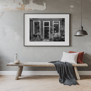 Cat sitting in Amsterdam window in black and white