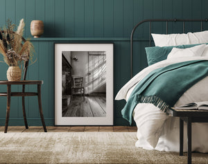 monochrome room with diagonal sunlight on wooden door