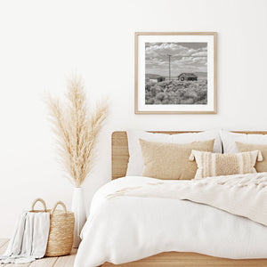 Abandoned buildings and sagebrush in a monochrome Nevada landscape