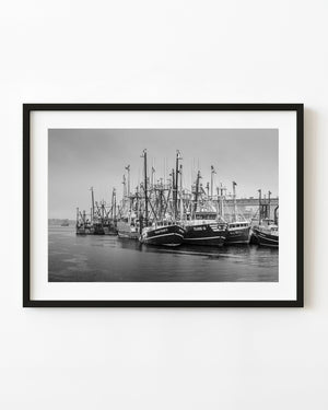 Working harbor scene with fishing boats in calm water